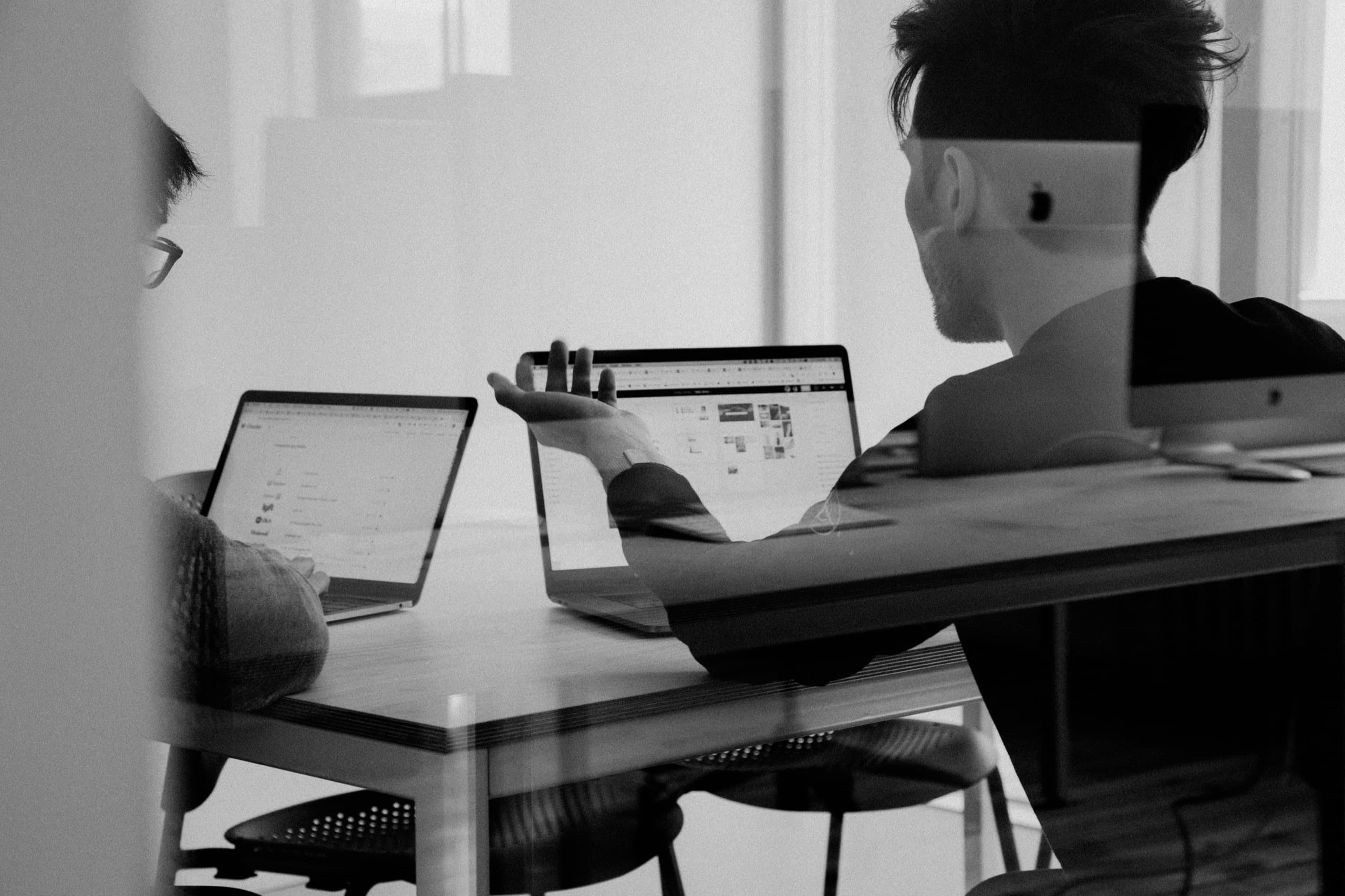 OneSpace team members working through project details together