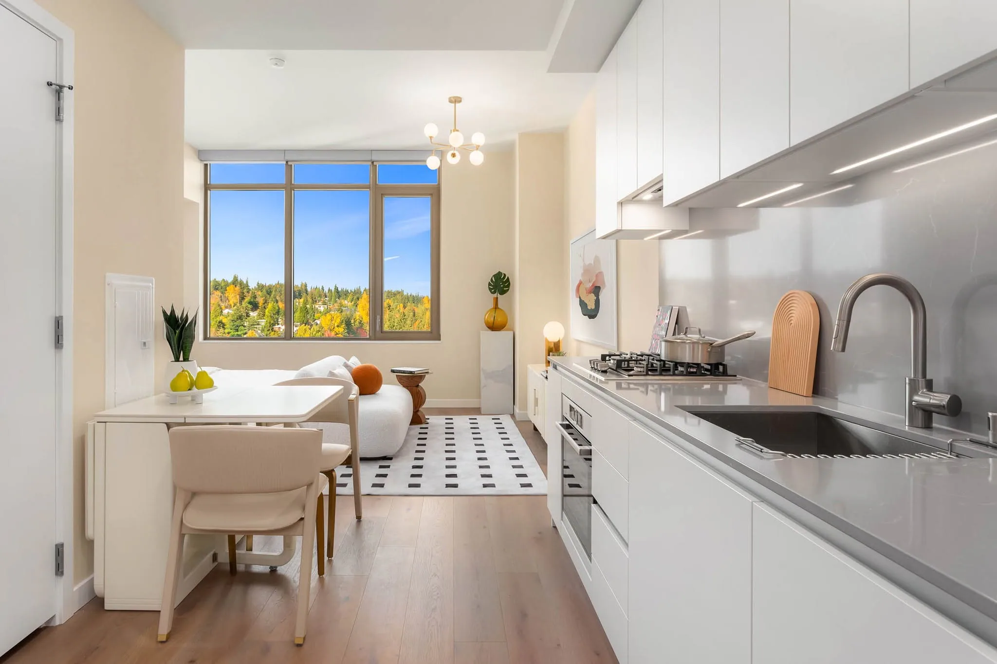 Compact model residence with integrated dining, working, and sleeping zones